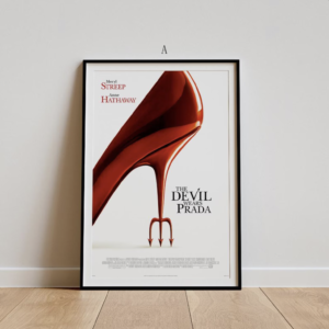 framed poster of the devil wears prada leaning against a pale wall showing a large red high heeled shoe artwork and movie title text